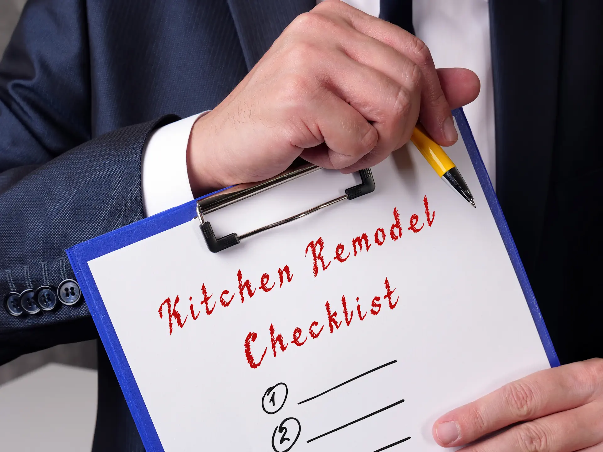 Homeowners reviewing kitchen remodeling design and budget options
