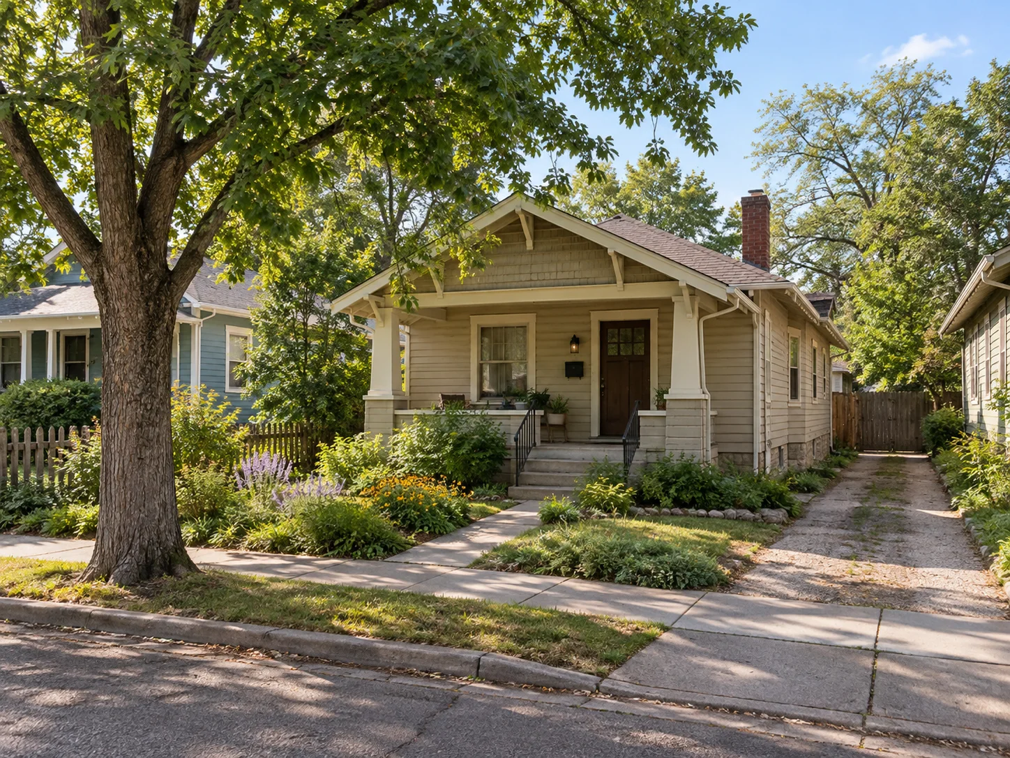 Small historic bungalow in Old Colorado City with a covered porch and mature trees