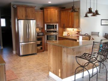 Kitchen Featuring Bigcreek Cabinets In Knotty Cherry