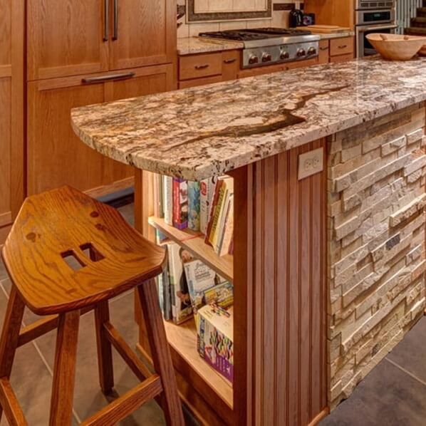 Shelves used as book case at end of kitchen island